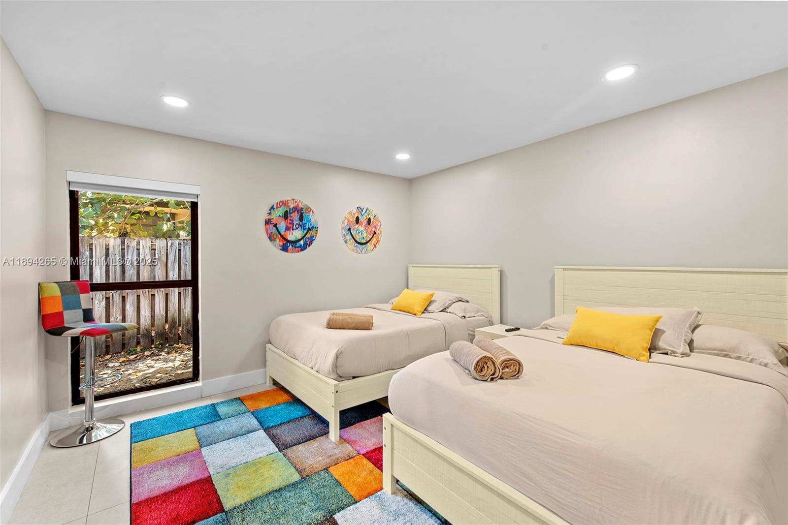 207 Holiday Drive Hallandale Beach, FL 33009 - Photo 41 of 50 a bedroom with 2 bed and a window