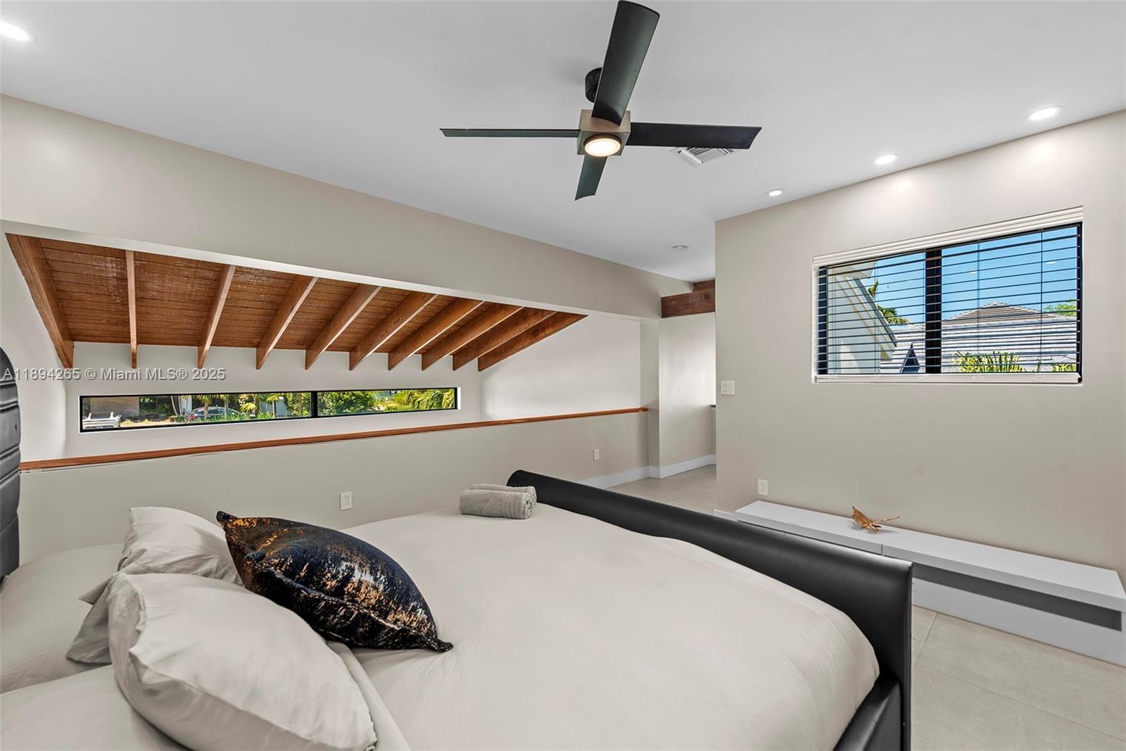 207 Holiday Drive Hallandale Beach, FL 33009 - Photo 48 of 50 a bedroom with a bed and window