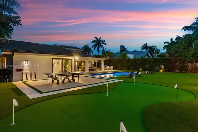 a view of a house with swimming pool yard and patio
