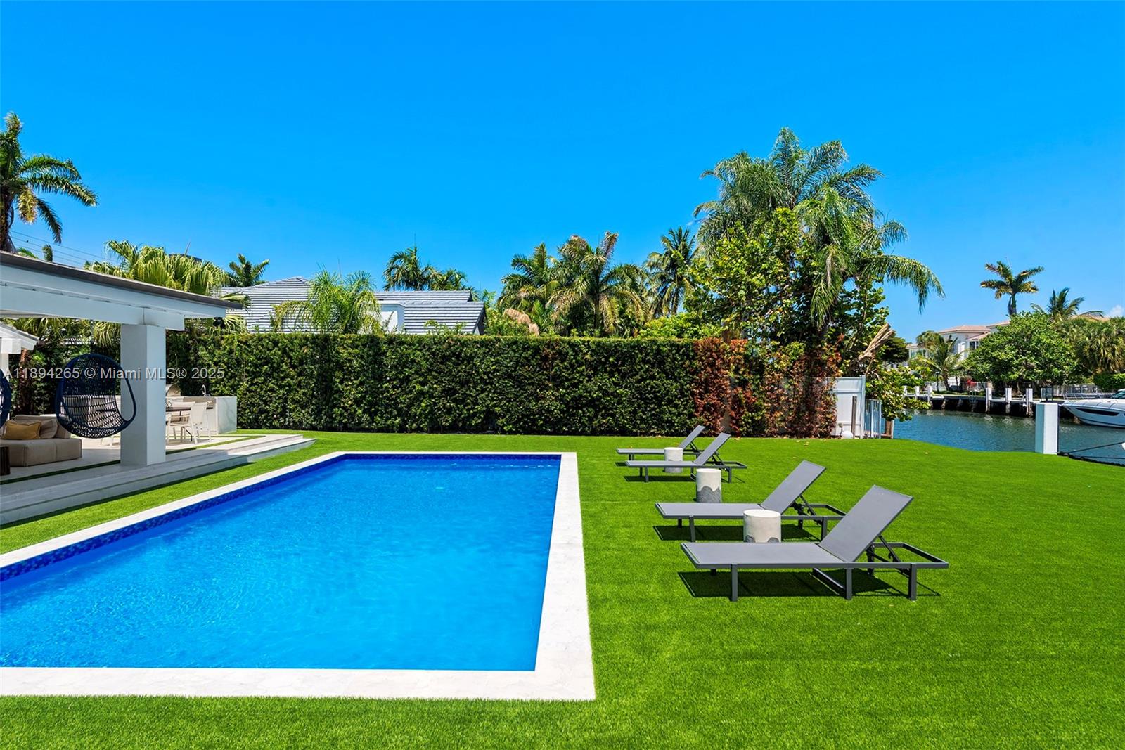 207 Holiday Drive Hallandale Beach, FL 33009 - Photo 10 of 50 a view of a house with a swimming pool