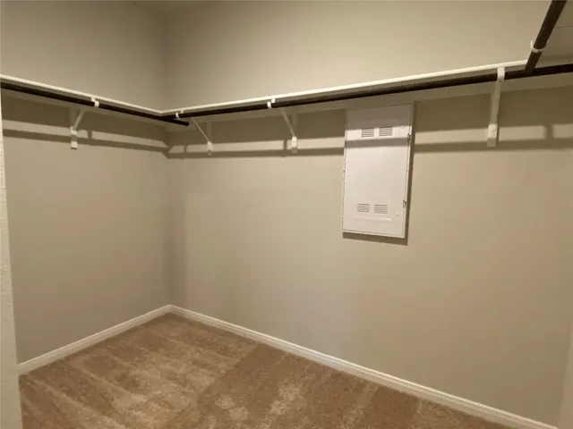 a bathroom with a granite countertop shower and a toilet