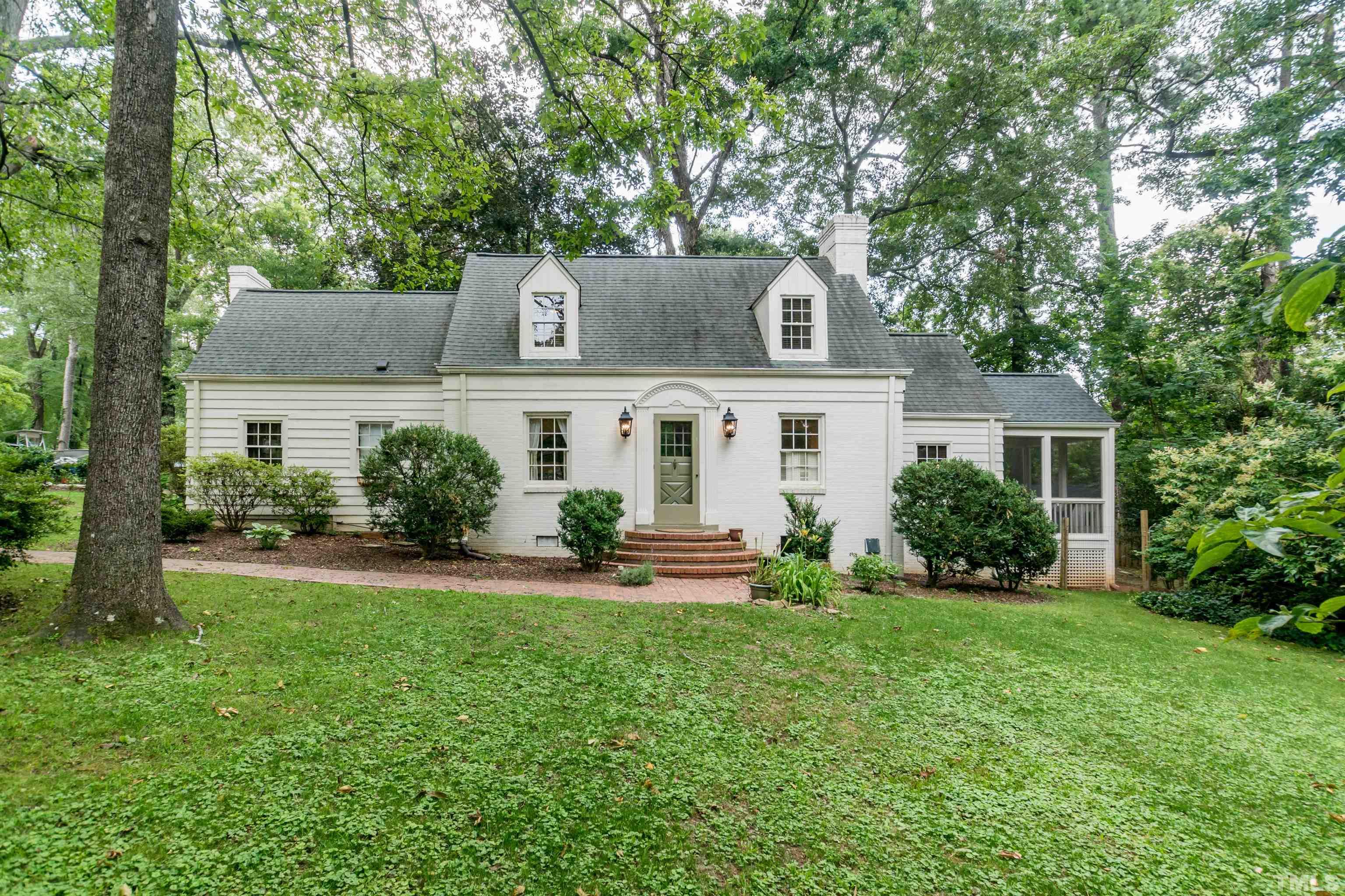 2601 London Drive Raleigh, NC 27608 - Photo 1 of 30 front view of house with a yard and potted plants