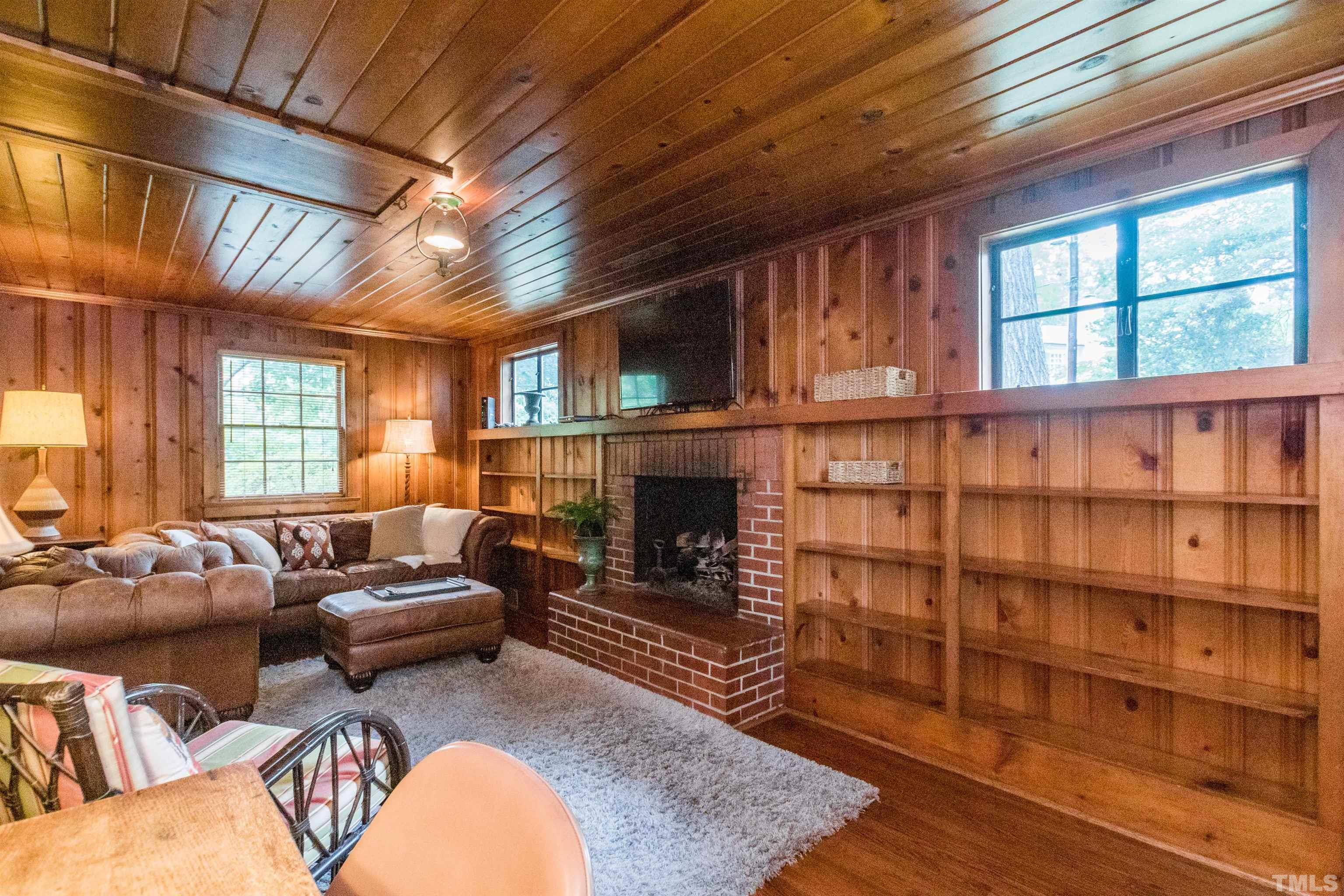 2601 London Drive Raleigh, NC 27608 - Photo 12 of 30 a living room with furniture wooden floor and a fireplace