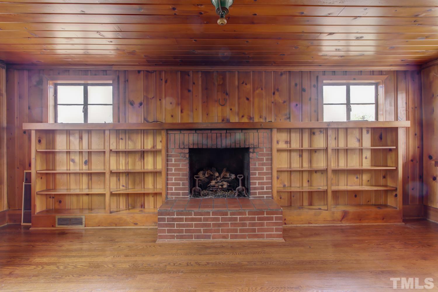 2601 London Drive Raleigh, NC 27608 - Photo 13 of 30 a view of an empty room with wooden floor and a window