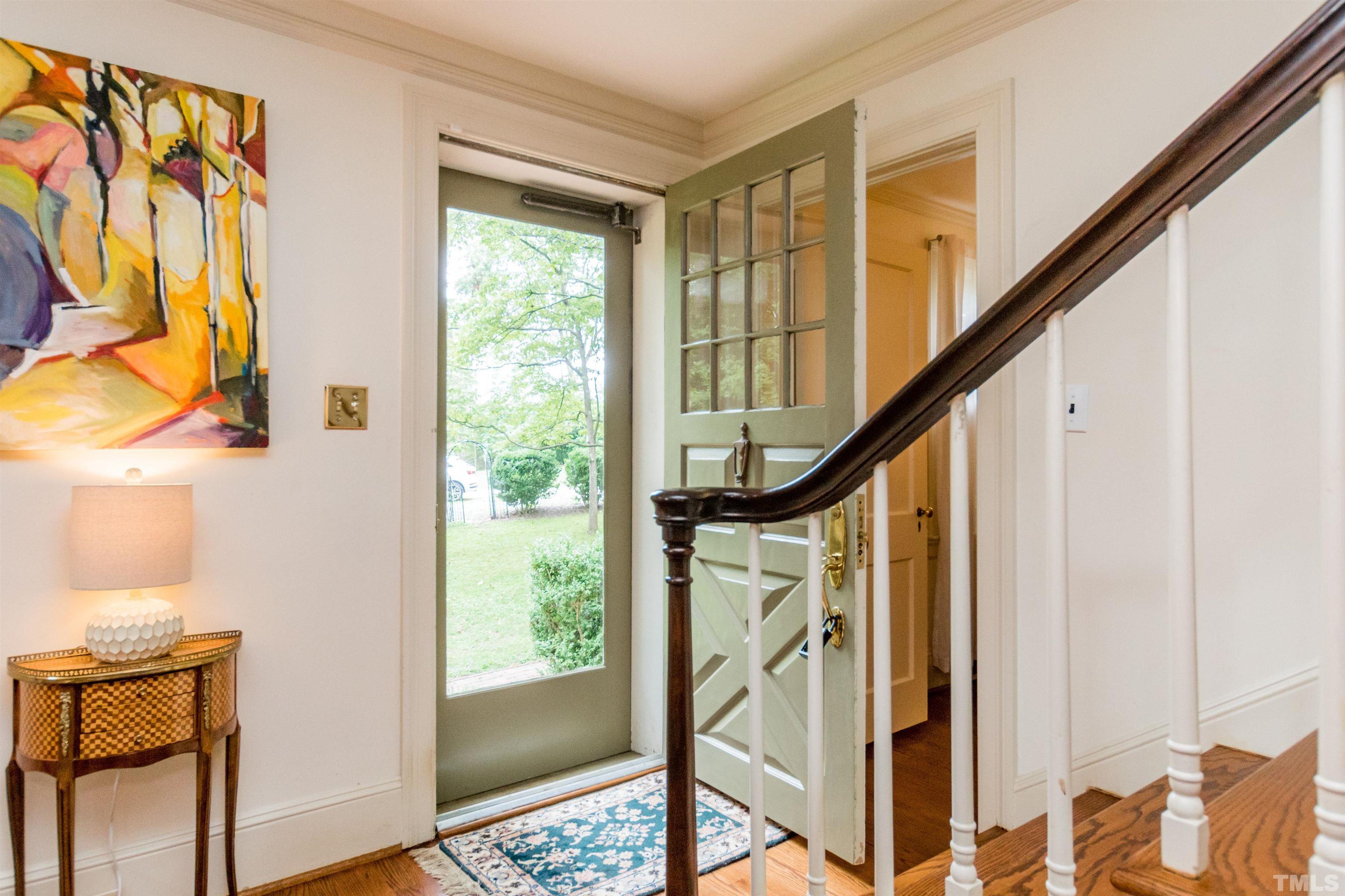 2601 London Drive Raleigh, NC 27608 - Photo 3 of 30 a view of an entryway with wooden floor and door
