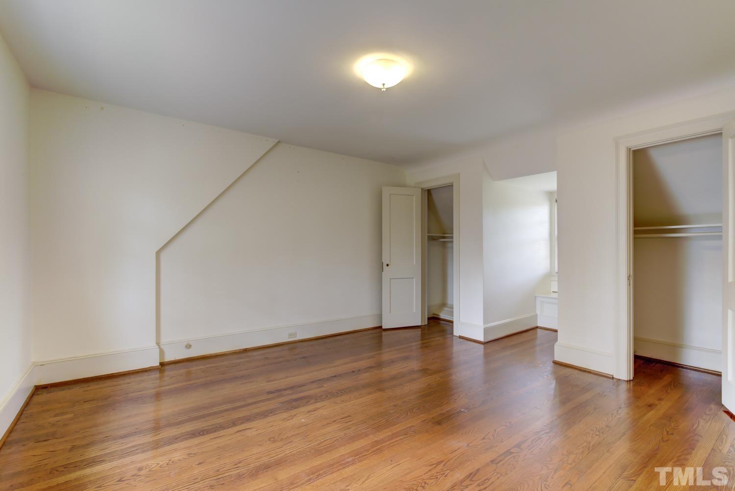 2601 London Drive Raleigh, NC 27608 - Photo 22 of 30 a view of an empty room with wooden floor
