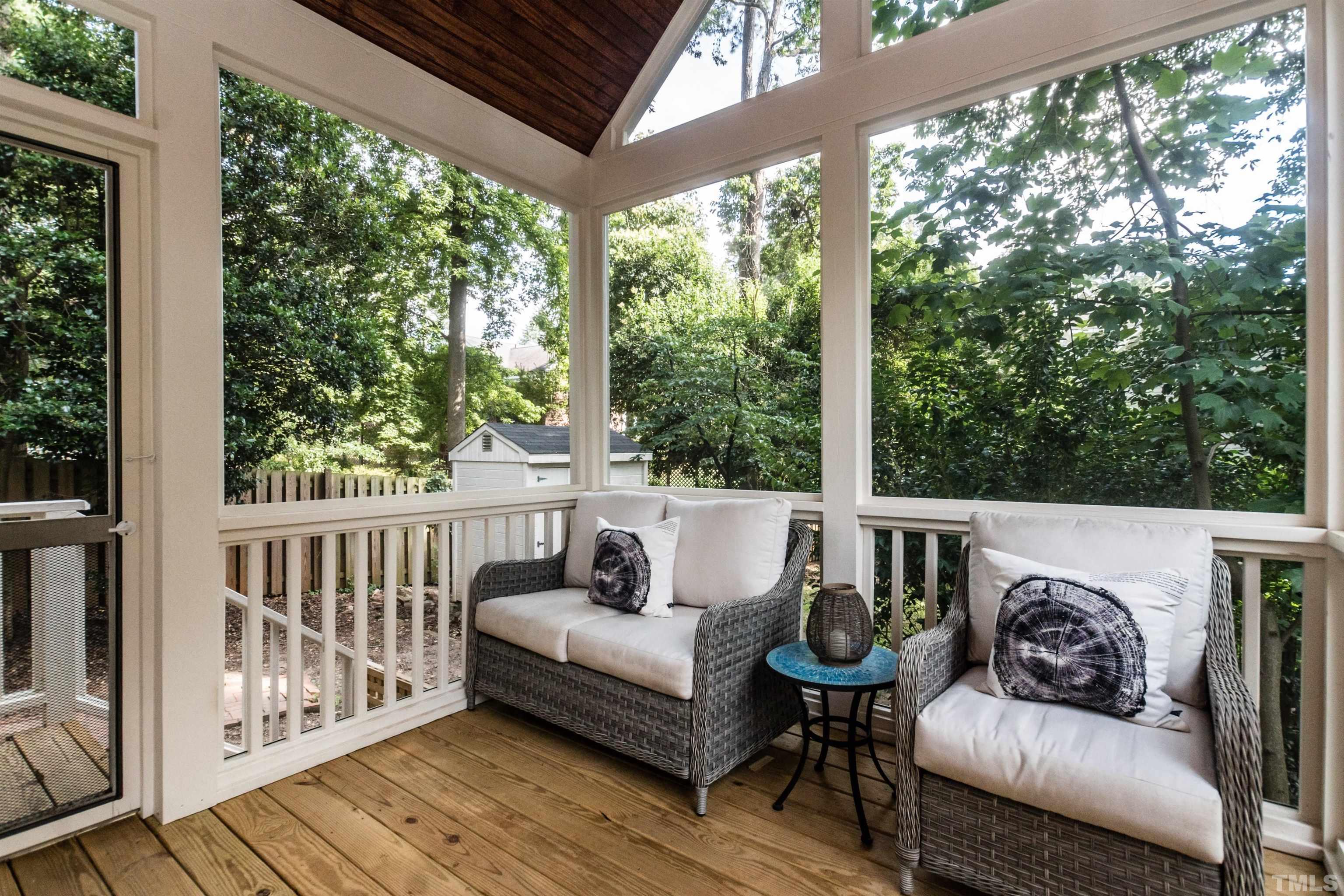 2601 London Drive Raleigh, NC 27608 - Photo 27 of 30 a balcony with couches and wooden floor