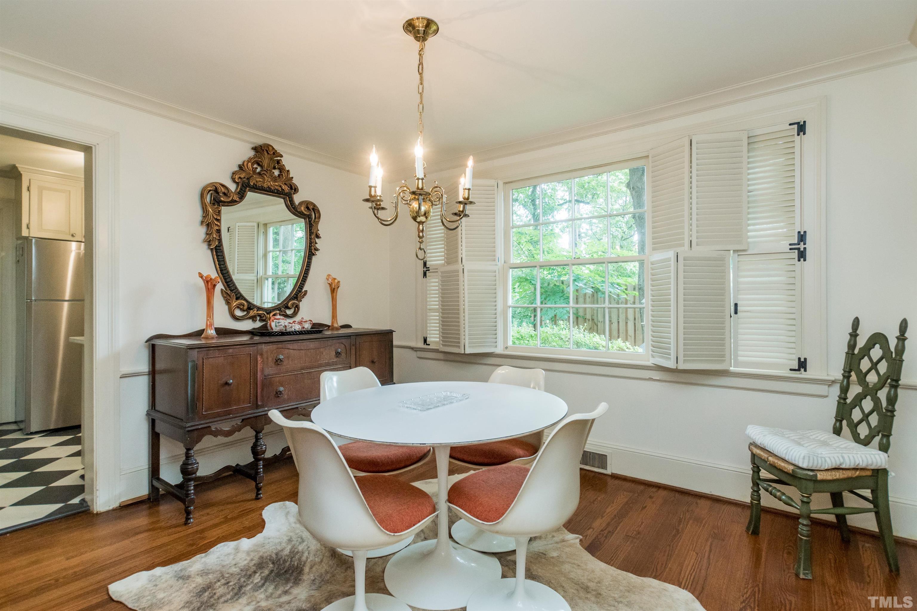 2601 London Drive Raleigh, NC 27608 - Photo 9 of 30 a view of a dining room with furniture window and wooden floor