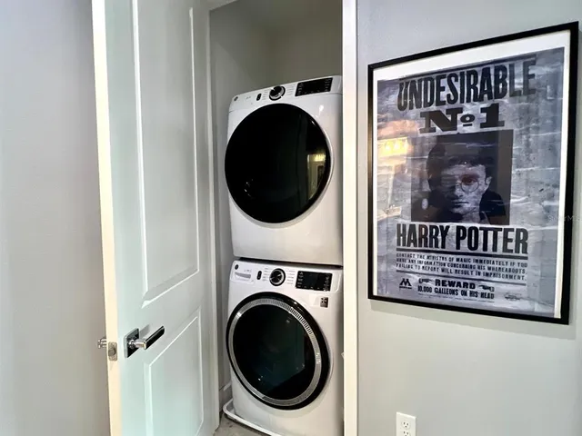 a view of a hallway with washer and dryer