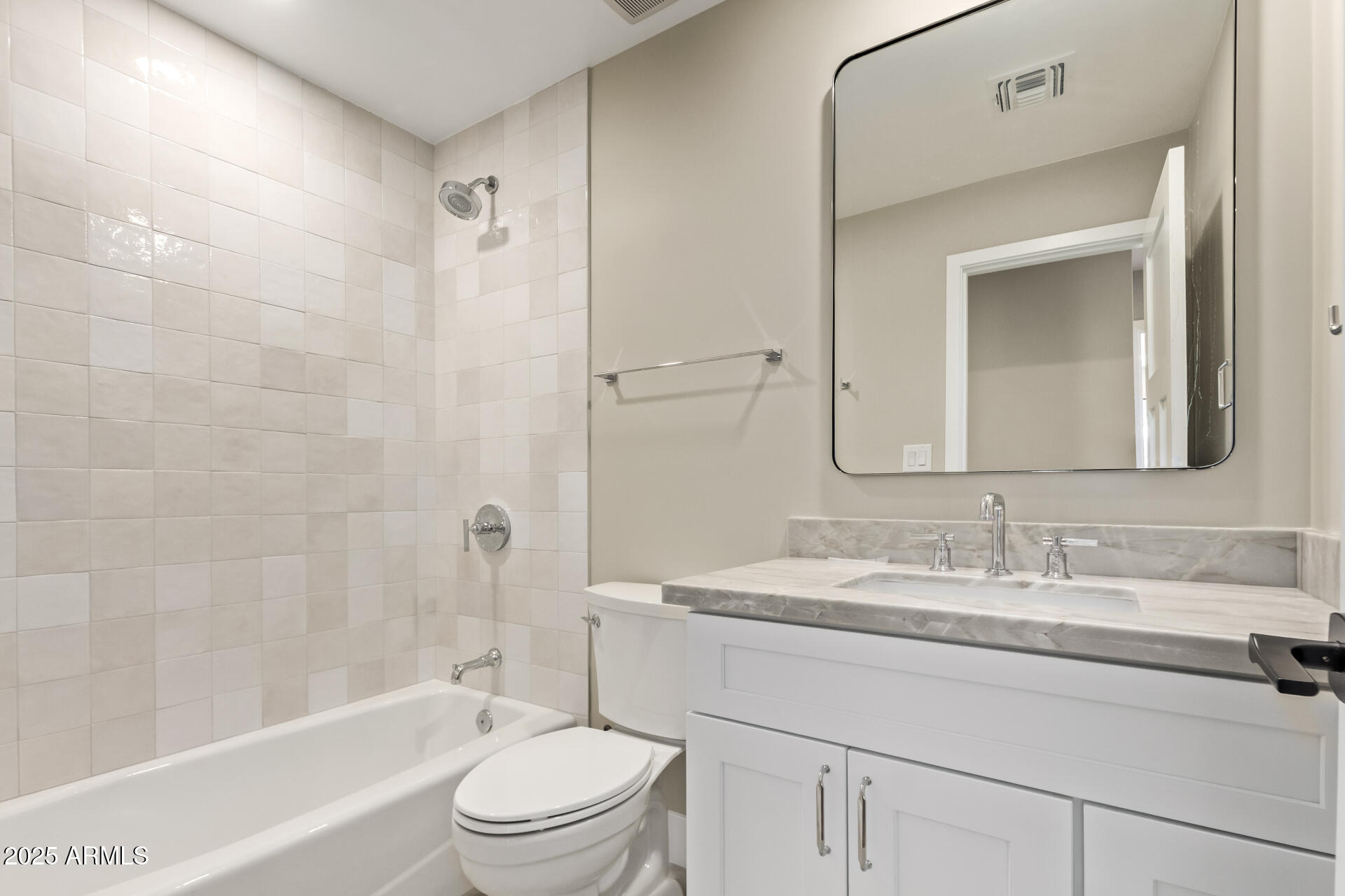 1540 West Lawrence Lane Phoenix, AZ 85021 - Photo 19 of 27 a bathroom with a bathtub shower sink vanity mirror and toilet
