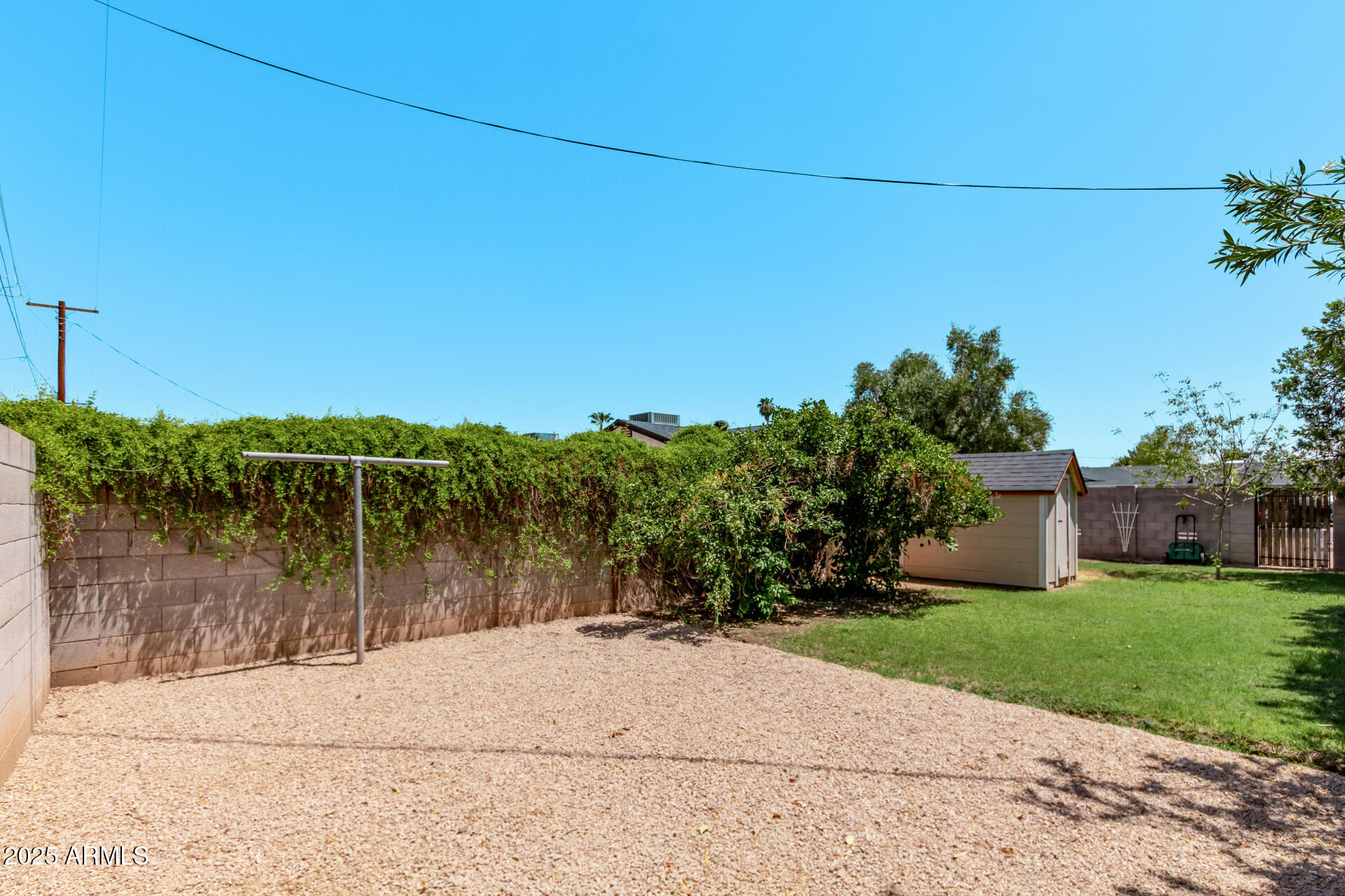 1540 West Lawrence Lane Phoenix, AZ 85021 - Photo 24 of 27 a view of a lake with a house in the background