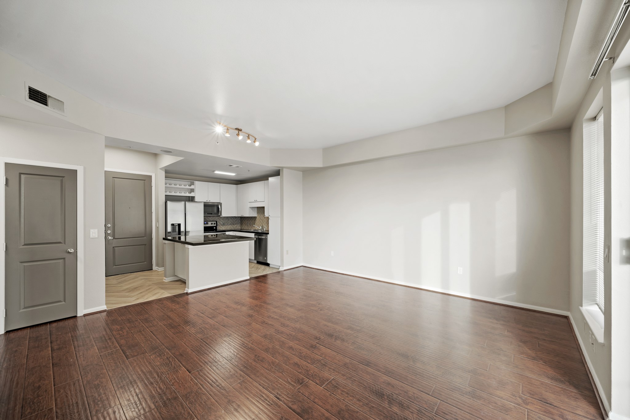 3505 Sage Road, Unit 1004 Houston, TX 77056 - Photo 10 of 17 a view of kitchen with wooden floor