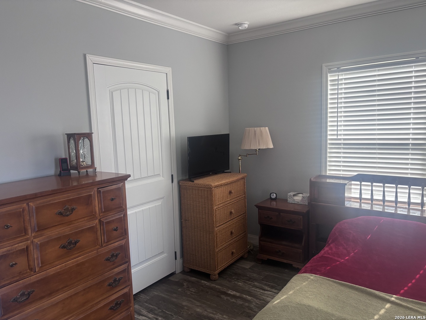 761 Baker Street Seguin, TX 78155 - Photo 15 of 19 a view of bedroom with a window and a dresser in it