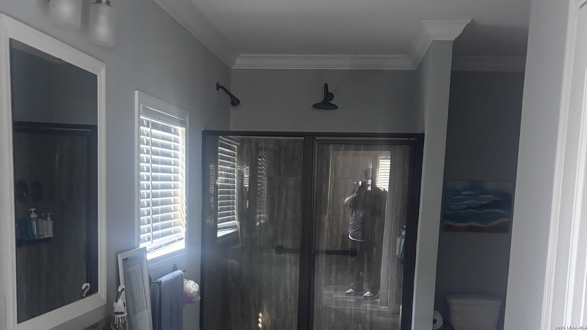 761 Baker Street Seguin, TX 78155 - Photo 16 of 19 a bathroom with a glass shower door