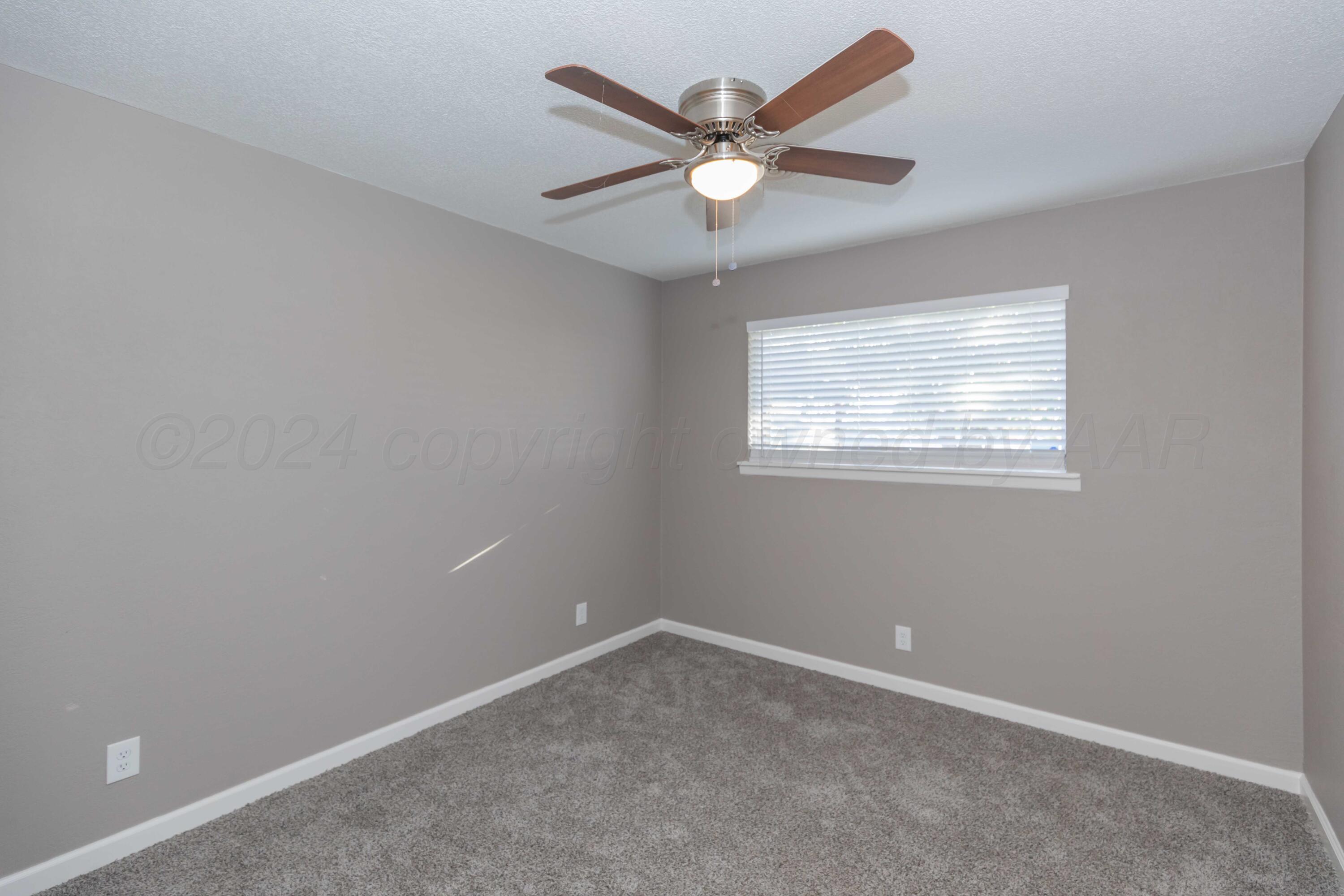 402 Beech Street Borger, TX 79007 - Photo 24 of 41 an empty room with a window