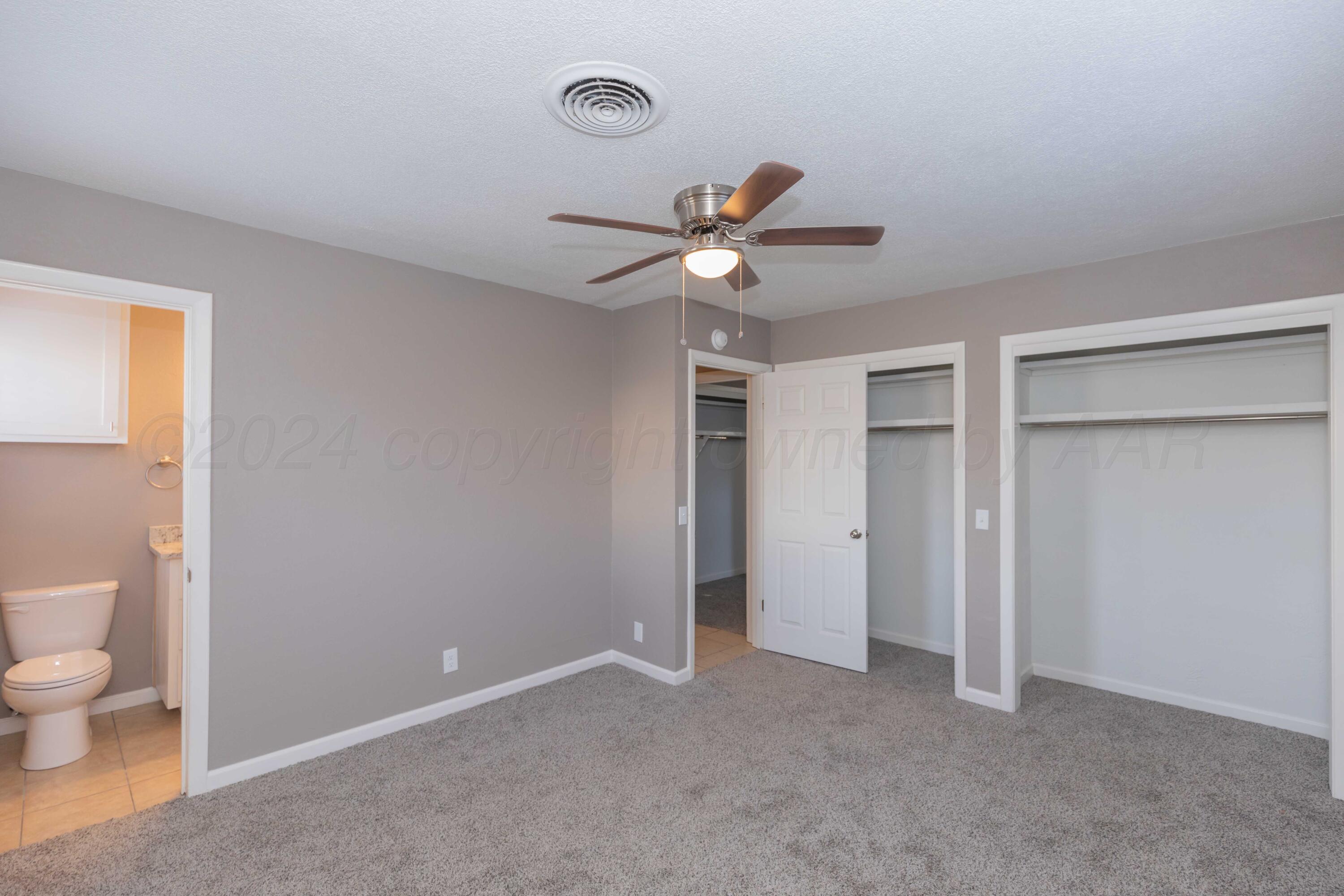 402 Beech Street Borger, TX 79007 - Photo 37 of 41 a view of a room with a ceiling fan and a rug