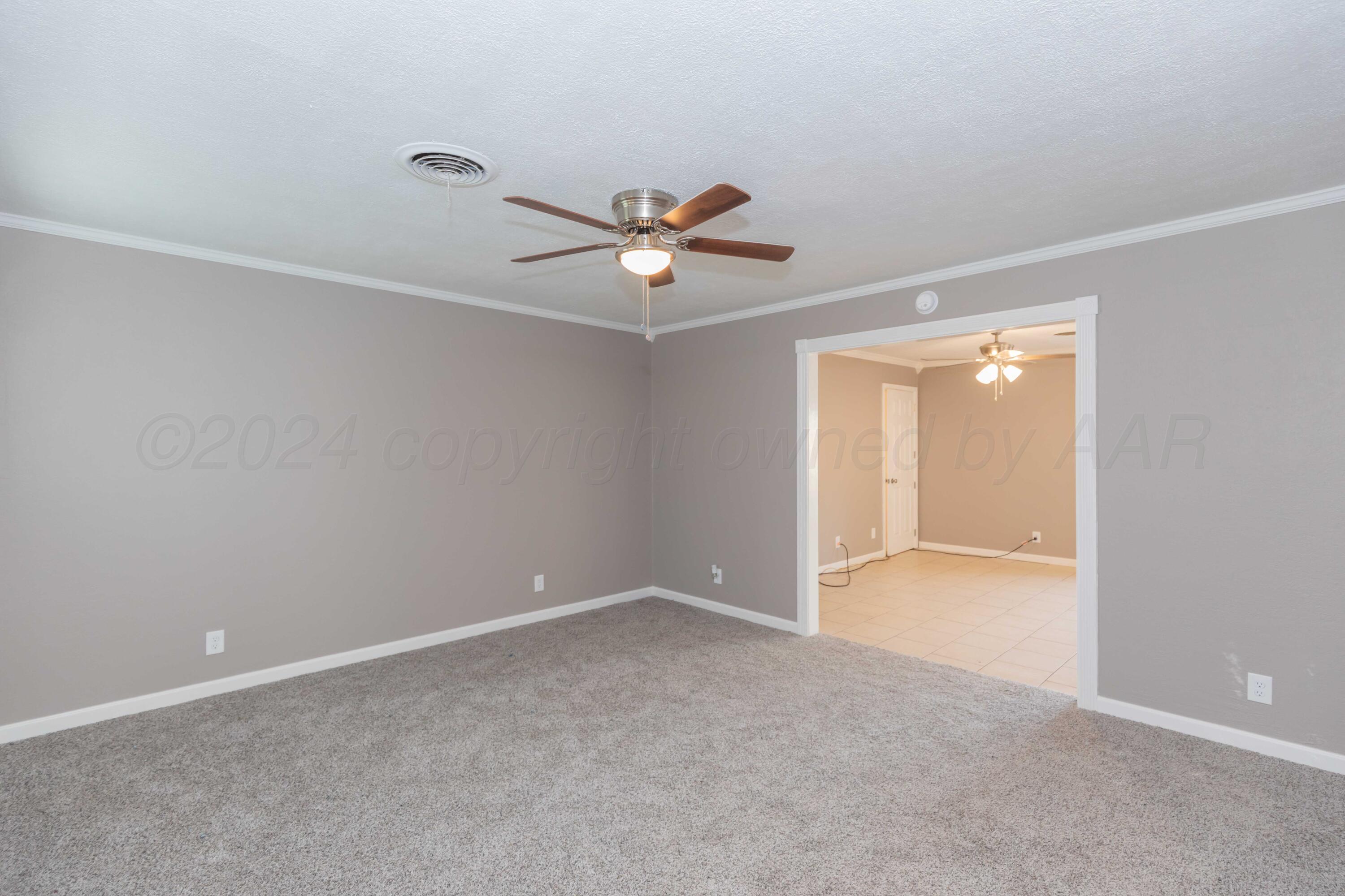 402 Beech Street Borger, TX 79007 - Photo 4 of 41 wooden floor in an empty room