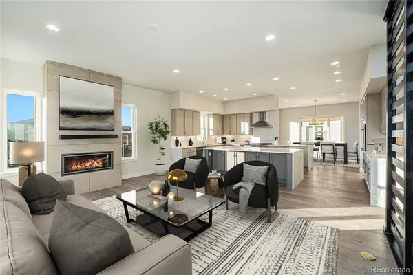 a living room with fireplace furniture and a flat screen tv