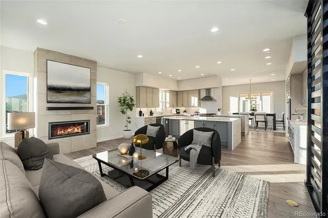 a living room with fireplace furniture and a flat screen tv
