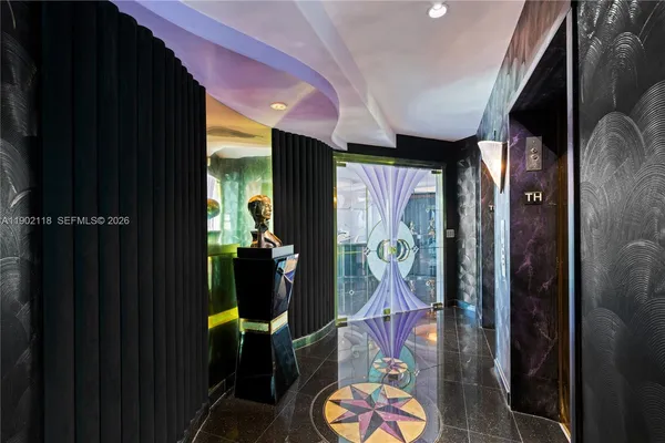 a room with lots of tables and a chandelier