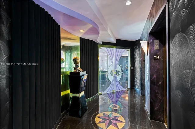 a room with lots of tables and a chandelier