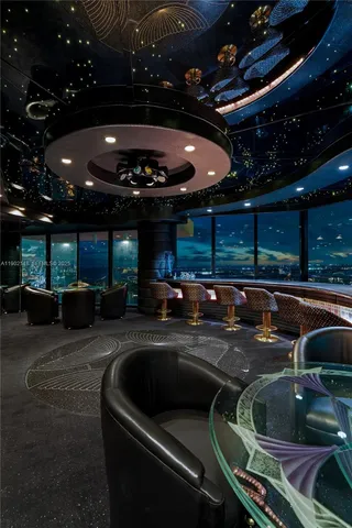 a view of a chairs and table in a patio