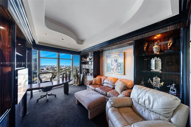 a room with furniture and a flat screen tv