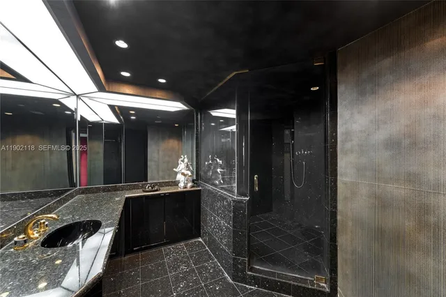 a bedroom with a bed and a dresser next to a window