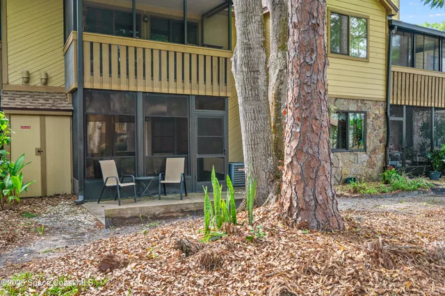 a backyard of a house with outdoor seating