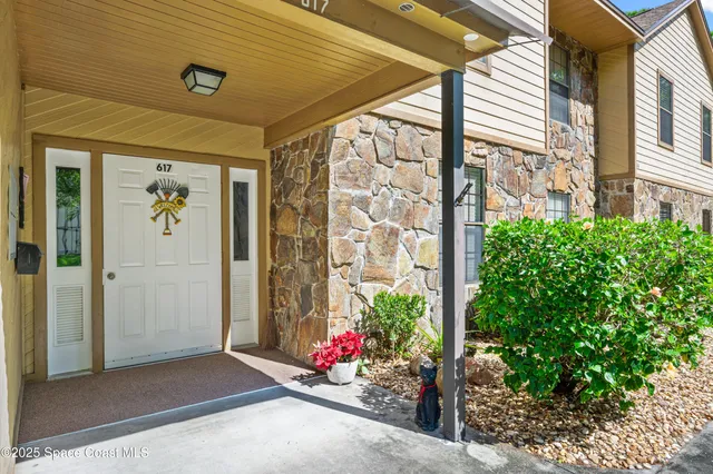 a view of a porch with a potted plant