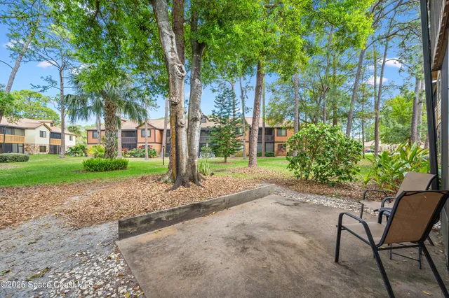 a wooden bench sitting in front of a house