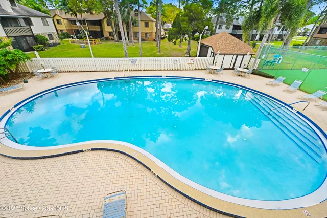 a view of swimming pool from a balcony