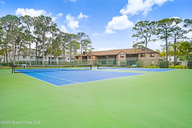 a view of a building with a yard