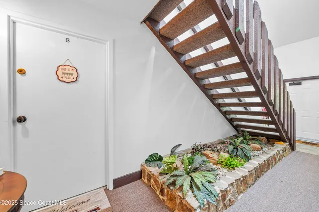 a view of entryway with wooden floor