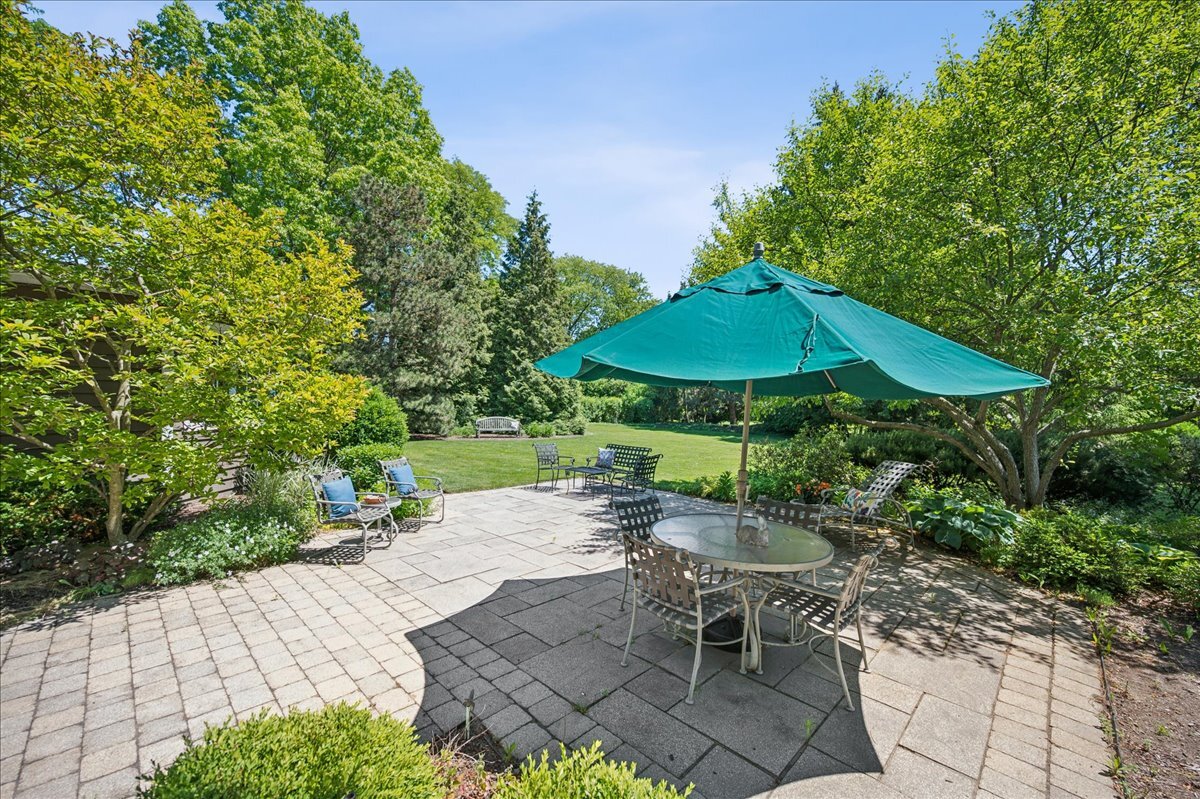 253 Summerfield Road Northbrook, IL 60062 - Photo 39 of 46 a view of backyard with seating space and trees