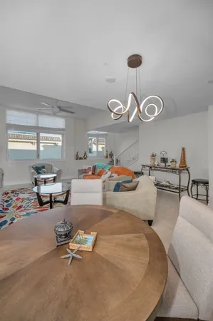 a kitchen with granite countertop a refrigerator stove and sink