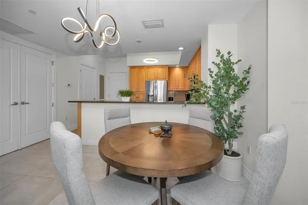 a kitchen with granite countertop a sink stainless steel appliances and cabinets