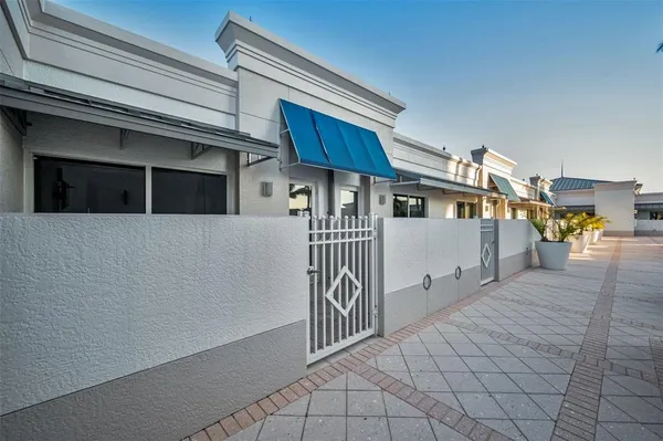 a room with a table chairs and a chandelier