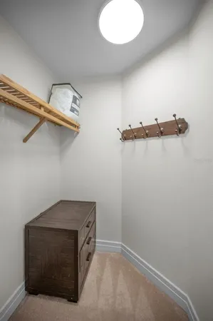 a view of swimming pool with outdoor seating and house in the background