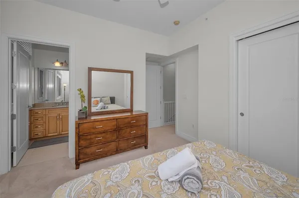 a view of a street with a chair and table in the patio