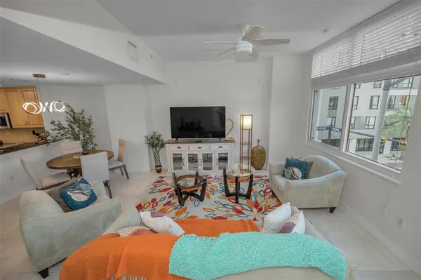 a living room with lots of furniture and a chandelier