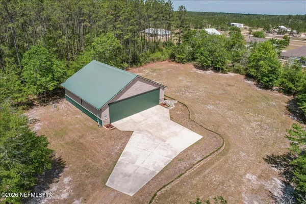 an aerial view of a house having yard