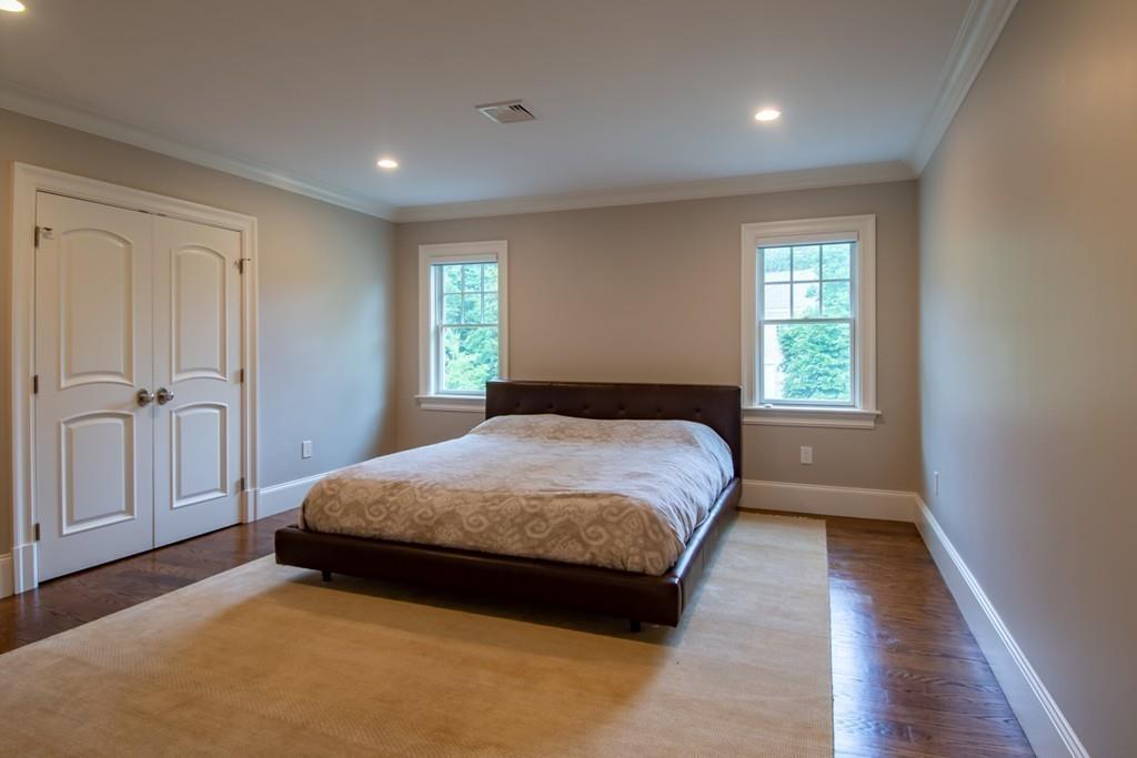 49 Bristol Road Wellesley, MA 02481 - Photo 19 of 30 a spacious bedroom with a bed and a window