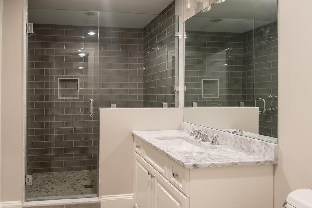 49 Bristol Road Wellesley, MA 02481 - Photo 20 of 30 a bathroom with a granite countertop sink a toilet and shower
