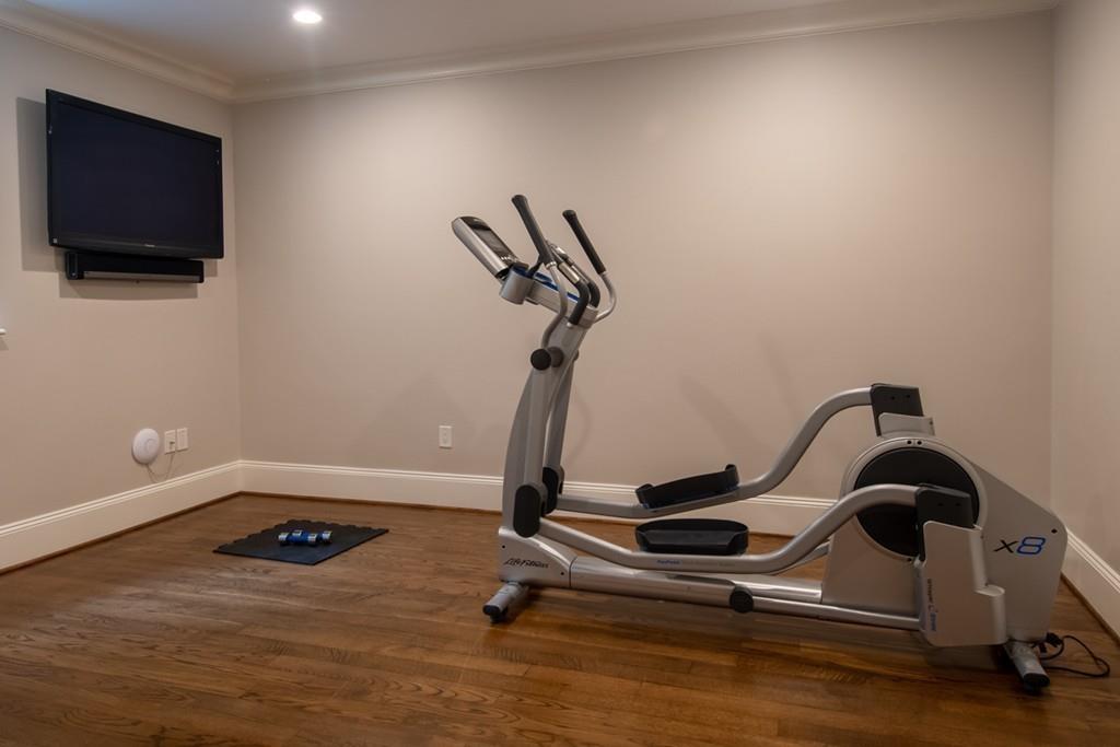 49 Bristol Road Wellesley, MA 02481 - Photo 24 of 30 a room with gym equipment and wooden floor