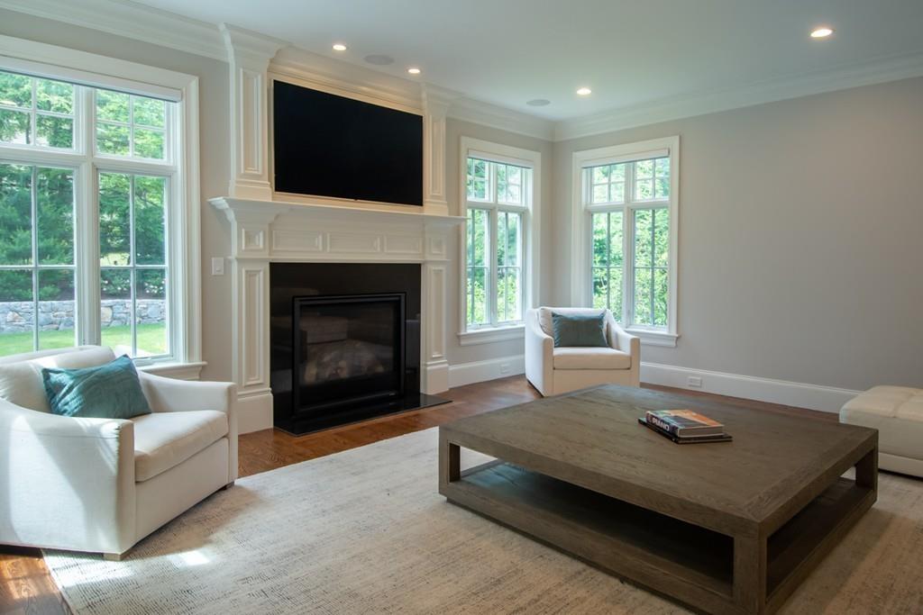 49 Bristol Road Wellesley, MA 02481 - Photo 6 of 30 a living room with furniture a flat screen tv and a fireplace