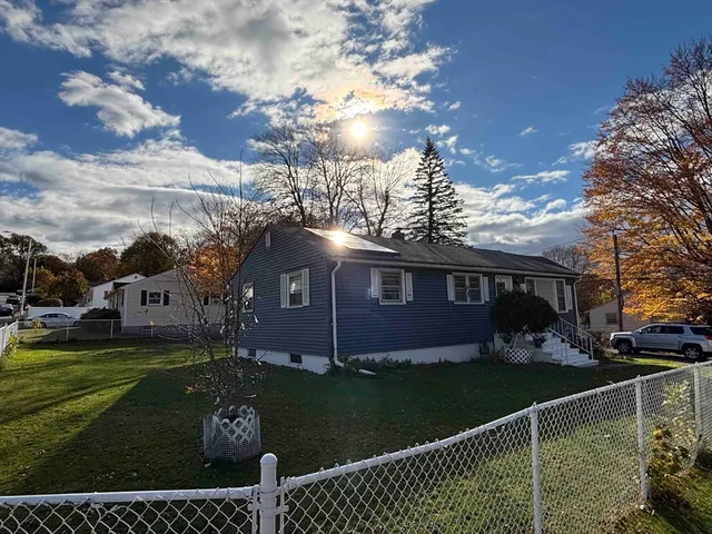 a view of house with yard