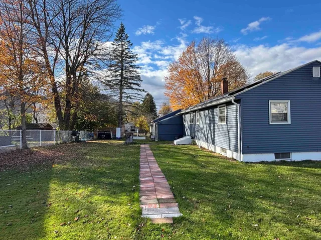a backyard of a house with lots of green space