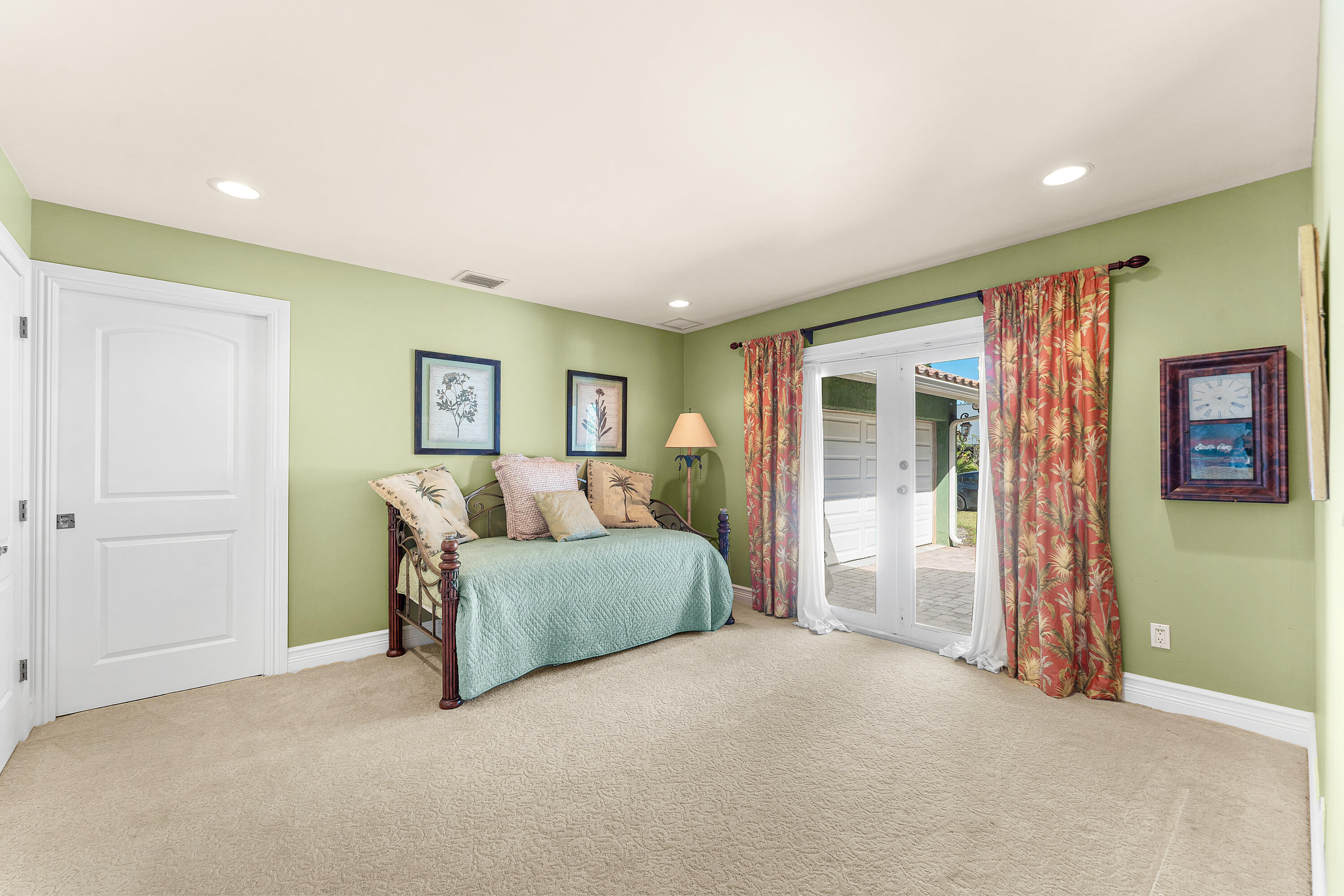 10295 St Andrews Road Boynton Beach, FL 33436 - Photo 15 of 43 a spacious bedroom with a bed and a couch