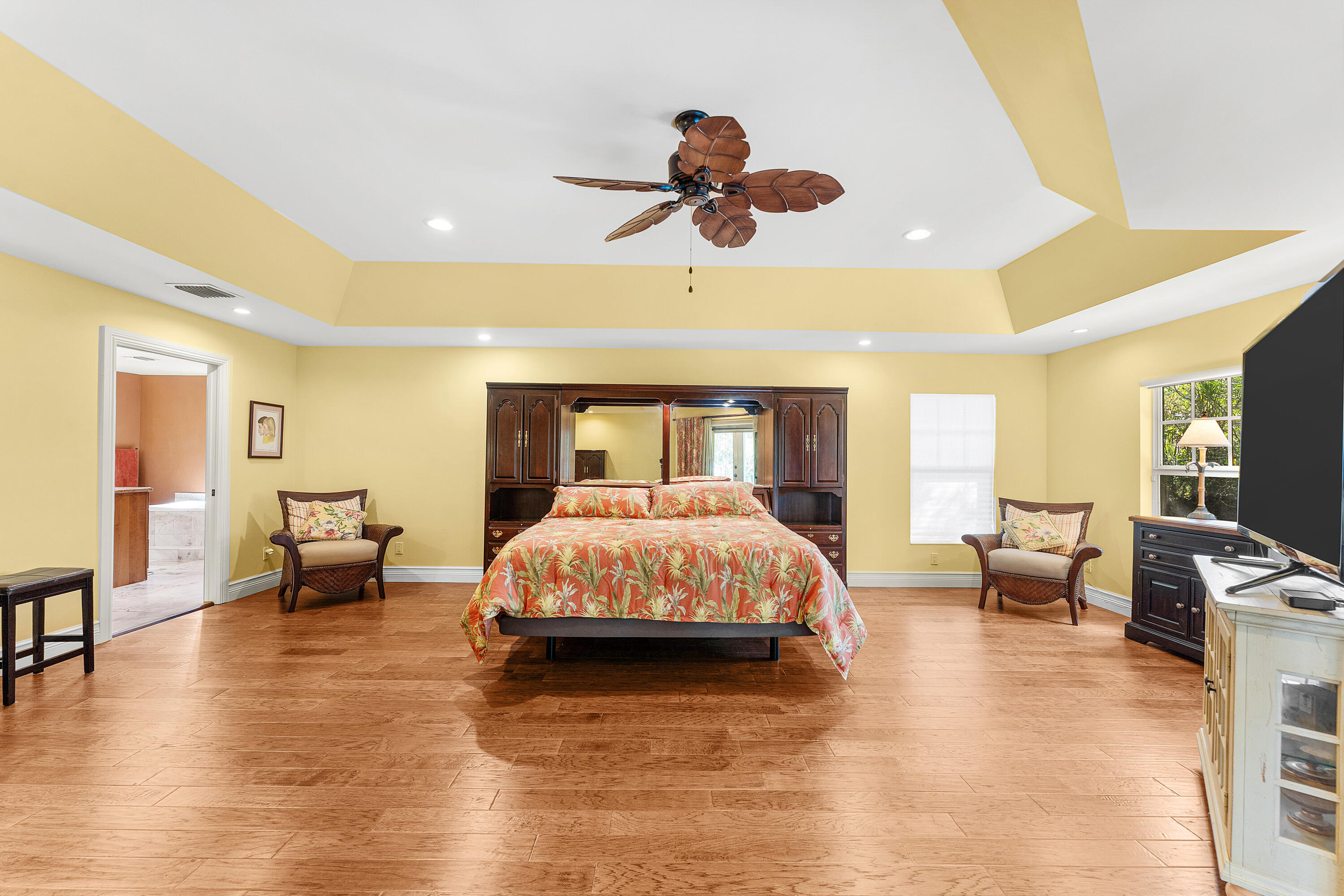 10295 St Andrews Road Boynton Beach, FL 33436 - Photo 17 of 43 a spacious bedroom with a bed and furniture